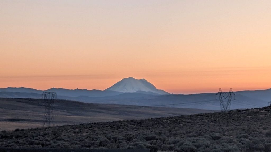 Mount Rainier silhouetted against a pink sunset during an eastern Washington road trip